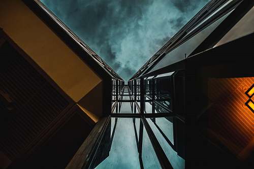 canada low angle photography of high-rise building under blue clouds architecture