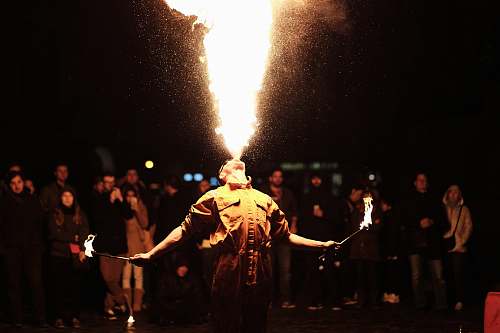 people person breathing fire performer