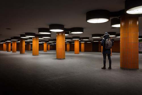 building person standing in parking lot architecture