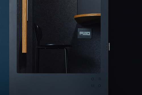 private black chair inside room phone booth