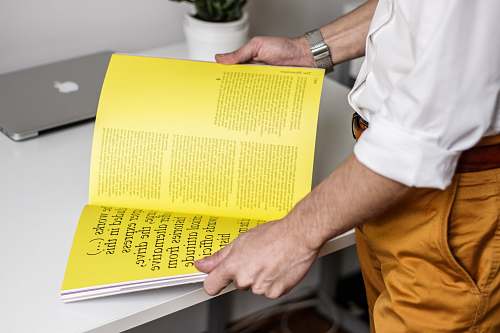 yellow person holding book book