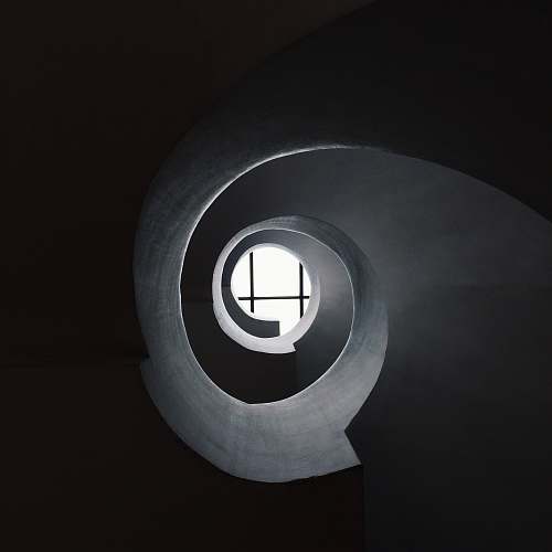 window bottom view of concrete spiral stair abstract