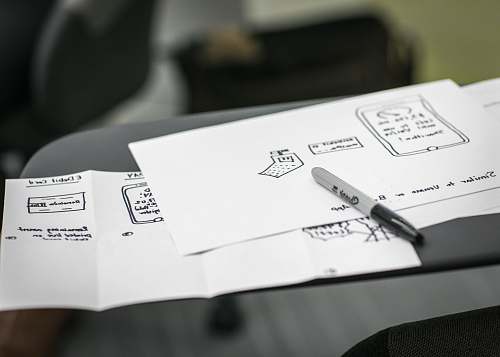 sketching black marker on white printer papers design