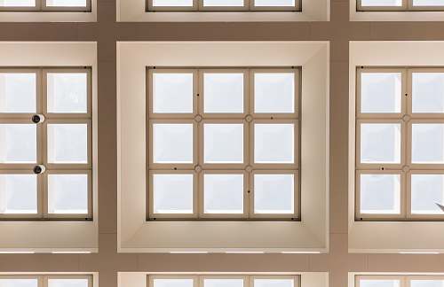 ceiling closeup photo of white and brown paneled frame lot skylight