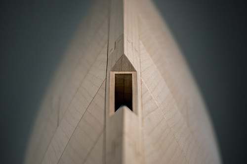 architecture closeup photography of wooden coin bank bell tower