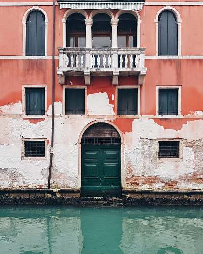 building green body of water under sunny sky door