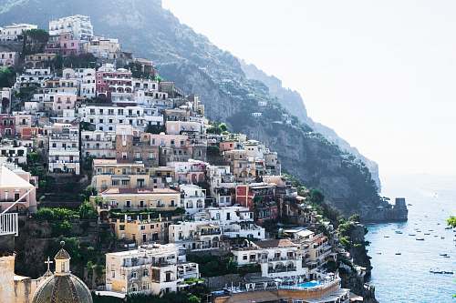 town photo of houses near ocean during daytime positano