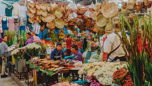 person people in market during daytime market
