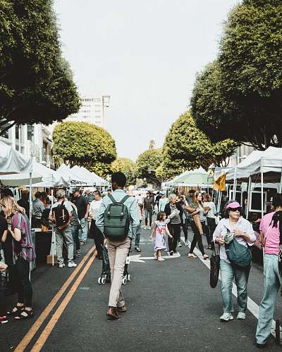 person people walking on walkway during daytime road