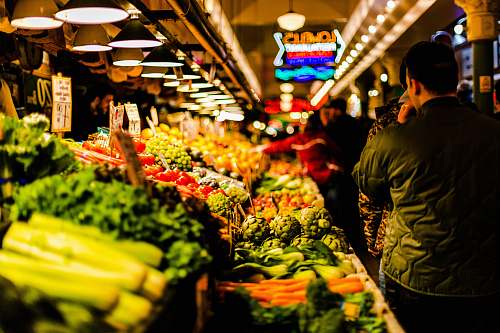 human man walking beside vegetables person