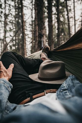 man lying on hammock