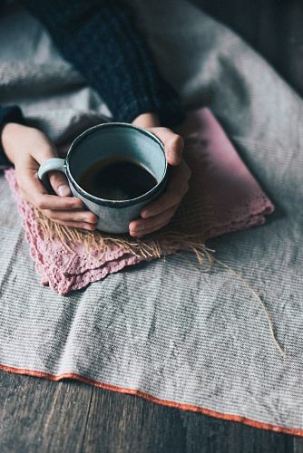 person holding green mug