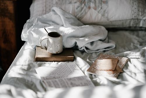 white and gray bed sheet