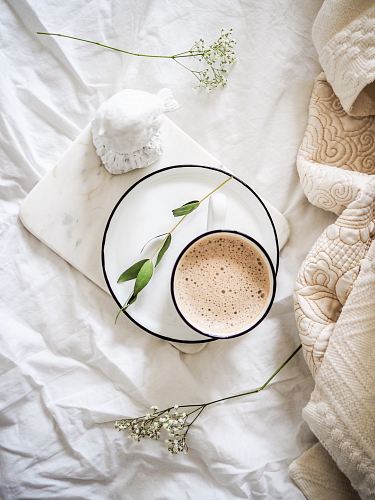 white teacup filled with coffee