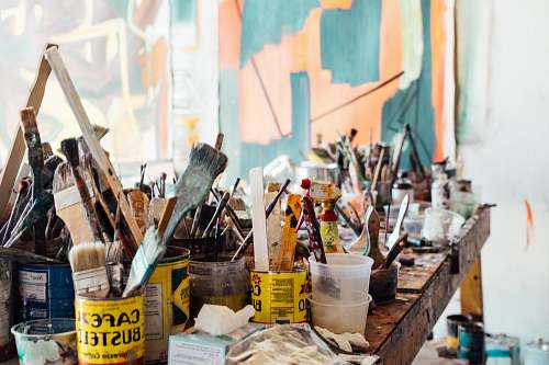 craft assorted-color paint brush on brown wooden table top paint brushes