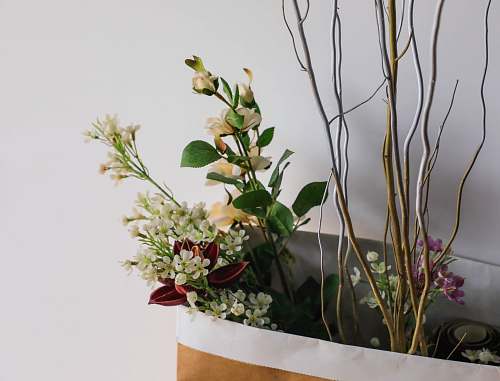 vase assorted flowers in shopping bag flower arrangement