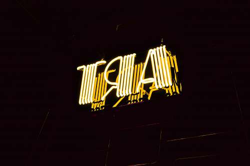 neon minimalist photography of yellow art neon light signage sign