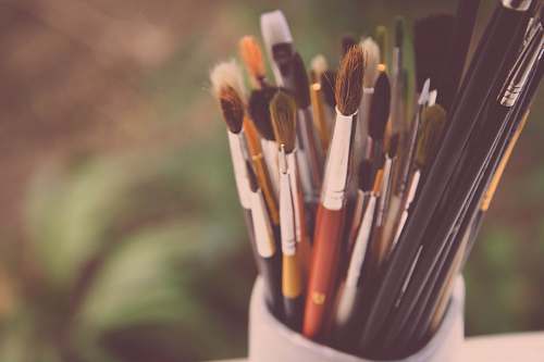 brush paintbrush lot on paintbrush holder during daytime creative
