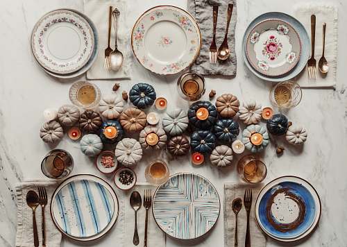 pottery pumpkins beside plates porcelain