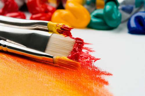 paint three silver paint brushes on white textile paintbrush