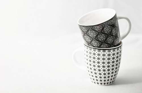 pottery two white-and-black mugs black-and-white