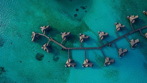aerial photography of resort villa on water