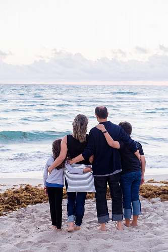 person a family of four on a beach apparel