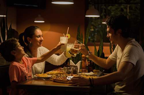 person three people having a toast on table people