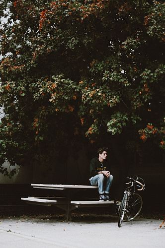 men sitting on picnic table