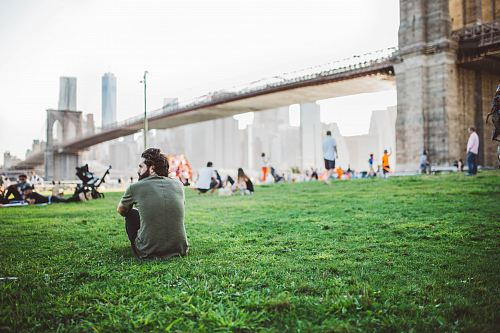 men's gray crew-neck t-shirt sitting on the grass
