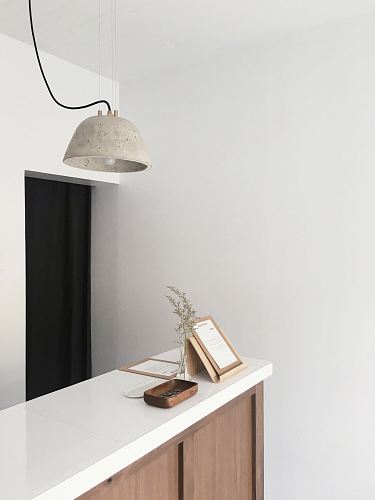 white and brown wooden counter near white wall