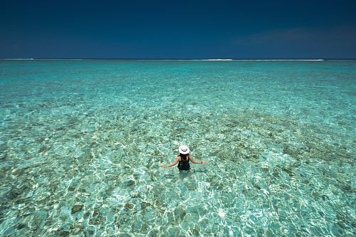 woman in body of water in birds eye photography