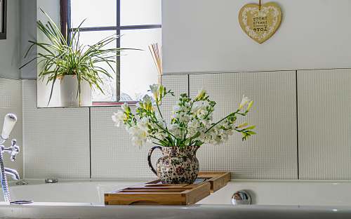 pottery white petaled flower jar