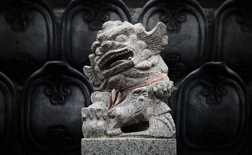 art gray Foo dog statue across sculpture