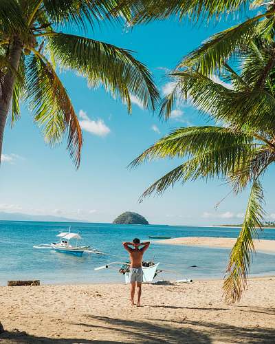 person man standing near beach line summer