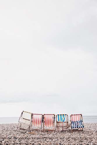 beach five chairs near costline chair