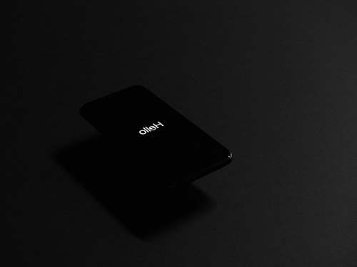 black black iPhone turned on electrical device