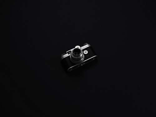 black DSLR camera with black background camera