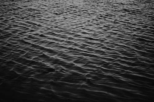 water grayscale photo of sea ripple