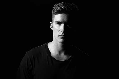 human grayscale photography of man wearing shirt person