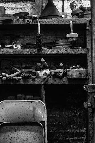 black grayscale photography of shelf with tools shelf
