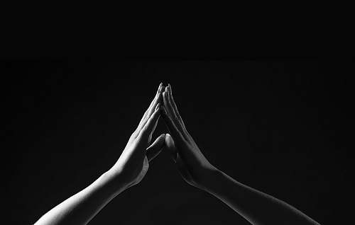 black person's hands forming triangle hands
