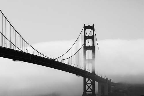 bridge silhouette of bridge covered by mist building