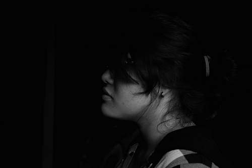 person woman standing in the dark human