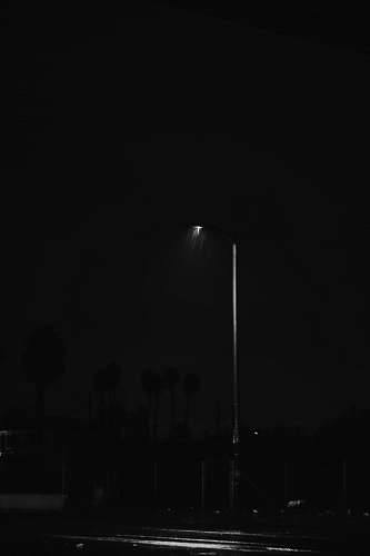 black-and-white black street light lamp post