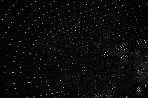 black-and-white black tunnel interior with white lights abstract