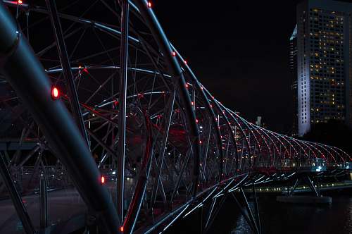 architecture gray Helix Bridge with red lights at nighttime singapore