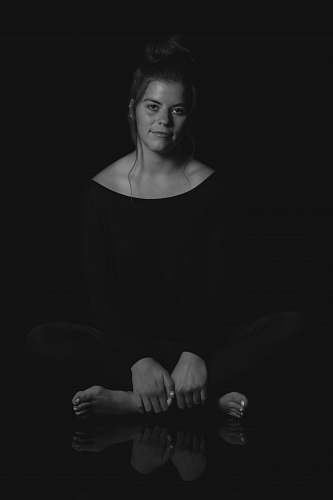 black-and-white grayscale photo of woman wearing leggings and blouse human