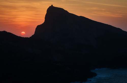 sunset silhouette of mountain at sunset capu rossu