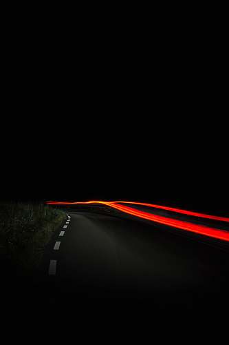 night time lapse photography of orange light light trail